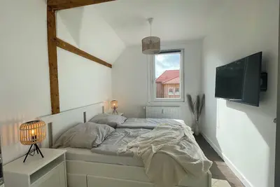 Image de Bright apartment with half-timbering and real wood floorboards in country house style with good location