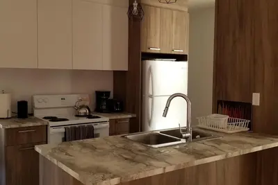 Image de Condo 10 minutes from the Mont Tremblant  ski slopes ( Pet-Friendly)