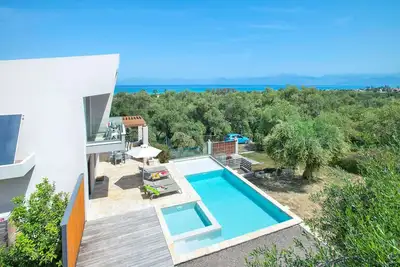 Stylish Modern Villa, A/C, Private Pool & Fabulous Sea Views 15mins walk to Acharavi or Roda Beach!