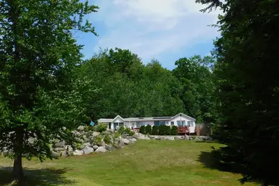 Image de **August Special** Brandy Pond oasis w/ large lawn and beautiful sandy beach!
