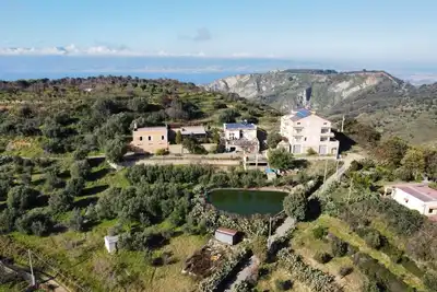 Image de Appartement dans une ferme 'Sant' Anna Ortì' avec vue sur la mer, jardin partagé et Wi-Fi