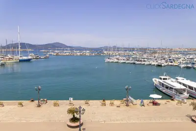 Image de Alghero Appartement Nettuno avec terrasse panoramique sur la mer et sur la baie