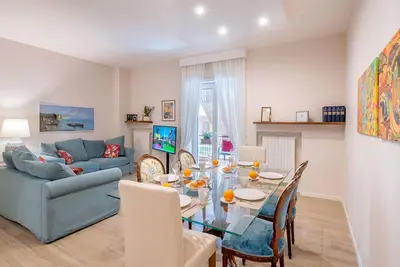 Image de Rentals in Italy - Apartment Bud with large balcony equipped with table and sofas.