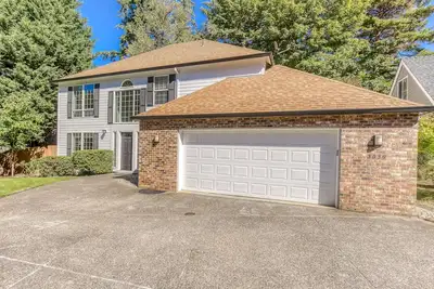 Updated home next to a park with fenced yard, deck, grill, & W/D