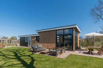 Image de Ce chalet pour 4 personnes est prêt à vous accueillir en bordure du parc. Le chalet dispose d'un séj