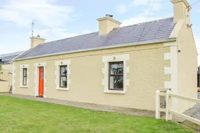 Glor Cottage, pet friendly, with a garden in Knock, County Mayo
