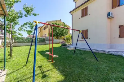 Image de Appartement de vacances avec un beau jardin à usage commun