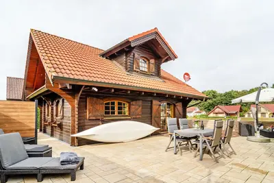 Image de Maison de vacances 'Das Alpenhaus An Der Ems' avec vue sur le lac, terrasse privée et Wi-Fi