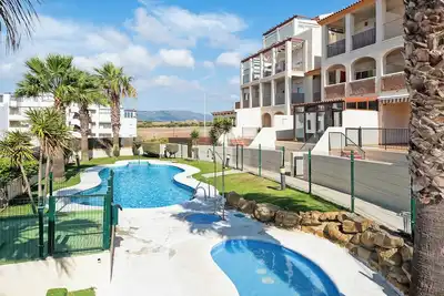 Image de Appartement \"Pool\" avec piscine partagée, terrasse privée et Wi-Fi