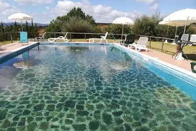 Image de Two-room apartment between Assisi Perugia and Gubbio. Pond and swimming pool.