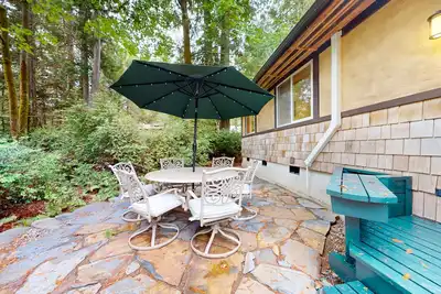 Image de Tree-lined retreat with wood fireplace, board game collection, & pool access