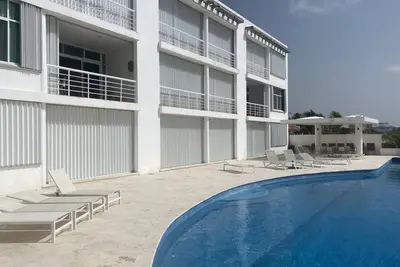 Quiet Beach Front Condo with patio overlooking Infinity Pool & Ocean