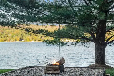 Rustic lakefront home with large balcony, wood fireplace, grill, & washer\/dryer