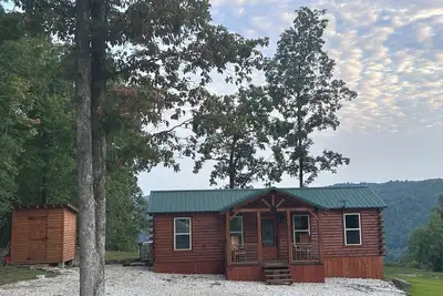 Image de Secluded off grid cabin located on mountain ridge looking down beautiful valley