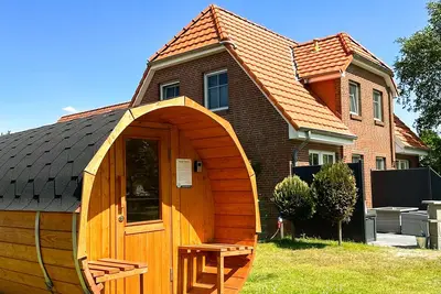 Image de LĂĽttje Huck - Ferienwohnung 3 mit Seeblick & Sauna